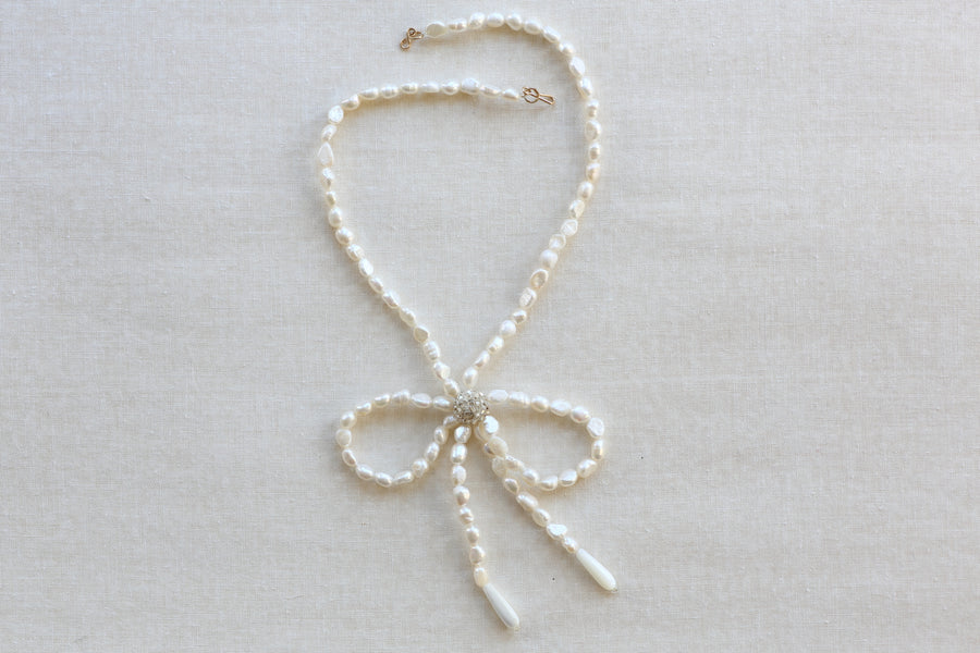 Jacki Holland Pearl Bowtie Necklace